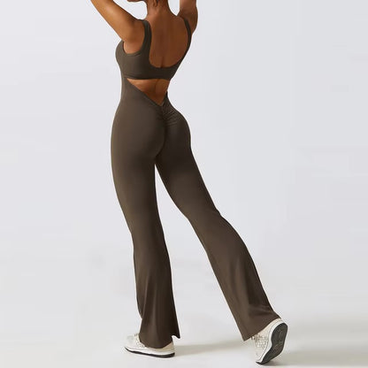 Woman posing in a brown yoga jumpsuit