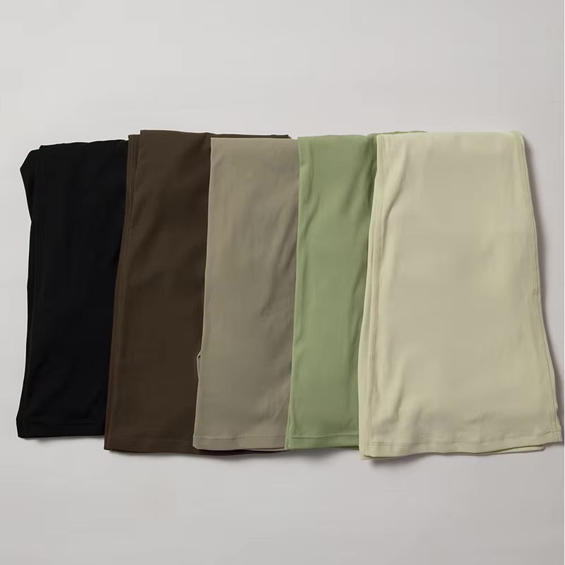 Folded gym-leggings in different colors; black, brown, olive green, gray, and beige