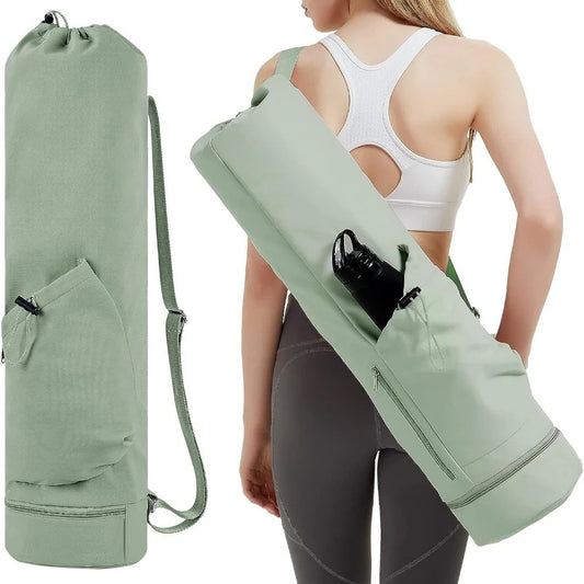 Woman carrying an olive green yoga mat bag 