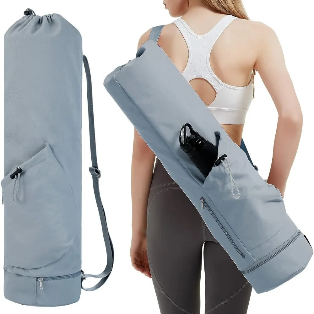 Woman carrying a light blue yoga mat bag 